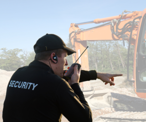 security personnel holding a phone